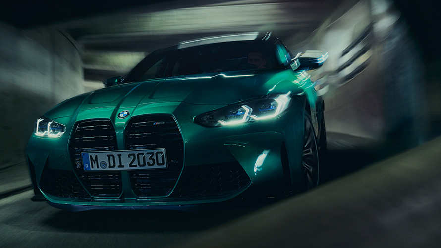 BMW M3 Competition Sedan G80 2021 BMW Individual Isle of Man Green metallic three-quarter driving a bend BMW M3 Competition Sedan G80 2021 BMW Individual Isle of Man Green metallic three-quarter driving a bend