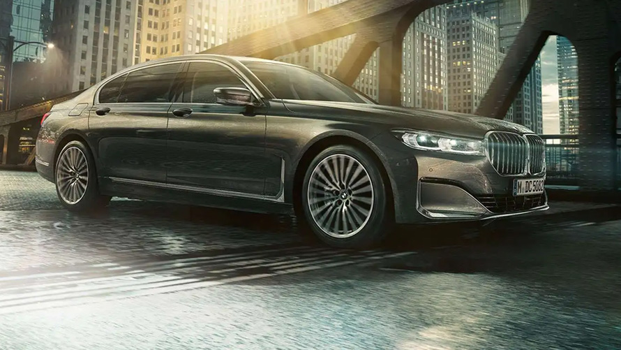 BMW M760Li xDrive Sedan G11 G12 2019 Frozen Dark Silver metallic three-quarter side view in urban setting  BMW M760Li xDrive Sedan G11 G12 2019 Frozen Dark Silver metallic three-quarter side view in urban setting